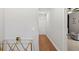 Hallway with hardwood floors and a modern glass table at 2708 W North B St # 3, Tampa, FL 33609