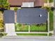 Aerial view of a house with a backyard, deck, and well-maintained landscaping at 3008 S Church Ave, Tampa, FL 33629