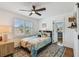 Bright bedroom features a ceiling fan, window with blinds, and an inviting turtle-themed bed at 3008 S Church Ave, Tampa, FL 33629