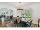 Bright dining room with hard wood floors, light colored walls and decorative chandelier at 3008 S Church Ave, Tampa, FL 33629