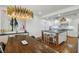 Open concept kitchen and dining area, with an island and a statement chandelier at 3008 S Church Ave, Tampa, FL 33629
