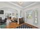 Bright foyer with hardwood floors, stained glass sidelights, archways, and statement mirror at 3008 S Church Ave, Tampa, FL 33629