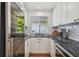 Well-equipped kitchen with stainless steel appliances, subway tile backsplash, and ample counter space at 3008 S Church Ave, Tampa, FL 33629