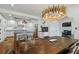 Open concept kitchen with long island, stainless appliances and modern lighting fixture at 3008 S Church Ave, Tampa, FL 33629