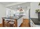 Gourmet kitchen featuring a large island, modern white cabinetry, and stainless steel appliances at 3008 S Church Ave, Tampa, FL 33629