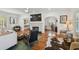 Open living space with hardwood floors, fireplace, and views into adjacent rooms through archways at 3008 S Church Ave, Tampa, FL 33629