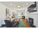 Cozy living room with fireplace, hardwood floors, and neutral décor and comfortable seating at 3008 S Church Ave, Tampa, FL 33629