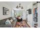 Cozy living room with a comfortable gray sofa, colorful rug, and modern decor at 3008 S Church Ave, Tampa, FL 33629