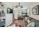 Cozy living space showcases a stylish sofa, hardwood floors, and windows with privacy blinds at 3008 S Church Ave, Tampa, FL 33629