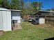A backyard featuring a storage shed, wooden fences, and a trailer at 315 Shore E Dr, Oldsmar, FL 34677