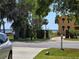 A lovely yellow home with beautiful landscaping is located near the water at 315 Shore E Dr, Oldsmar, FL 34677