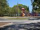 A bright, colorful playground offers a variety of equipment for , complete with an American flag at 315 Shore E Dr, Oldsmar, FL 34677