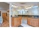 Bathroom featuring dual sinks, granite counters, wooden cabinetry, with access to the bedroom and toilet at 316 Crystal Goblet Ct, Valrico, FL 33594
