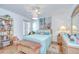 Bright bedroom with hardwood floors, a ceiling fan, and colorful decor at 316 Crystal Goblet Ct, Valrico, FL 33594