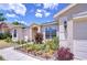 Beautiful landscaping and vibrant plants adorn the front of this well-maintained single story home at 316 Crystal Goblet Ct, Valrico, FL 33594