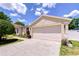 Single story home featuring a large two car garage and convenient driveway at 316 Crystal Goblet Ct, Valrico, FL 33594