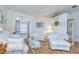 Bright living room with hardwood floors, lots of seating and natural light from a large window at 316 Crystal Goblet Ct, Valrico, FL 33594