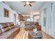 Open-concept living room with hardwood floors flowing into the kitchen and dining area at 316 Crystal Goblet Ct, Valrico, FL 33594