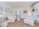 Bright and airy living room with hardwood floors, lots of seating and natural light at 316 Crystal Goblet Ct, Valrico, FL 33594