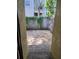 Private back patio area enclosed by a wooden fence and mature vines at 3206 W Azeele St # 108, Tampa, FL 33609