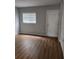 Spacious bedroom with wood-look flooring and ample closet space at 3206 W Azeele St # 108, Tampa, FL 33609