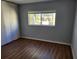 Comfortable bedroom featuring vinyl flooring, and natural light from the window at 3206 W Azeele St # 108, Tampa, FL 33609