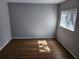 Bright bedroom with hardwood floors and natural light from the window at 3206 W Azeele St # 108, Tampa, FL 33609