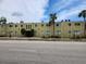 Exterior of Palma Ceia Gardens Condominiums shows lush landscaping and classic architecture at 3206 W Azeele St # 108, Tampa, FL 33609
