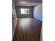 Bright living room with wood-look floors and neutral color palette at 3206 W Azeele St # 108, Tampa, FL 33609