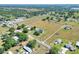 Vast property showcasing a charming home, open land, and various outbuildings, set within a serene, rural landscape at 3434 E Keysville Rd, Lithia, FL 33547