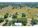 Expansive property featuring a spacious home, large open field, and multiple outbuildings, all within a defined boundary at 3434 E Keysville Rd, Lithia, FL 33547