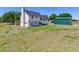 Aerial view of back of home with outbuilding at 3434 E Keysville Rd, Lithia, FL 33547