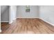 Spacious bedroom featuring hardwood floors, neutral colors and a large window at 3434 E Keysville Rd, Lithia, FL 33547