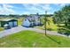 Beautiful two-story home featuring an attached garage, well-manicured lawn, and a detached metal building at 3434 E Keysville Rd, Lithia, FL 33547