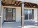 Inviting front entry featuring a modern front door, sidelights, and support columns at 3434 E Keysville Rd, Lithia, FL 33547