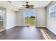 Bright living room with wood floors and sliding glass doors that lead to the outdoors at 3434 E Keysville Rd, Lithia, FL 33547