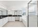 Bathroom featuring a double vanity, a large mirror, and tiled flooring at 3488 Great Banyan Way, Wesley Chapel, FL 33543
