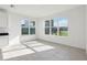 Bright dining area featuring large windows with views of the backyard and lake at 3488 Great Banyan Way, Wesley Chapel, FL 33543