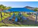Colorful playground with slides and play structures, covered by a large shade, offering fun for  at 3488 Great Banyan Way, Wesley Chapel, FL 33543