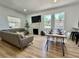 Bright and open living and dining area features hardwood floors, a fireplace and lots of natural light at 4202 N Suwanee Ave, Tampa, FL 33603