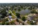 Aerial view of a quiet suburban neighborhood with a central pond at 4421 28Th N Ave, St Petersburg, FL 33713