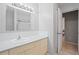 Well-lit bathroom with a vanity and a doorway leading to another room at 4421 28Th N Ave, St Petersburg, FL 33713