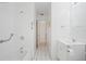 Well-lit bathroom with a combination shower and bath with grab bars at 4421 28Th N Ave, St Petersburg, FL 33713