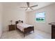 Bedroom featuring vintage-style furniture, ceiling fan and a window view at 4421 28Th N Ave, St Petersburg, FL 33713