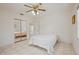 Bright bedroom featuring a ceiling fan, tile floors, and a mirrored closet at 4421 28Th N Ave, St Petersburg, FL 33713