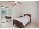 Comfortable bedroom with ceiling fan, mirrored closet doors, tile floors, and natural light at 4421 28Th N Ave, St Petersburg, FL 33713