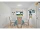 Bright dining area with tile flooring, glass table, and scenic water views at 4421 28Th N Ave, St Petersburg, FL 33713