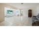 Bright living room with tile flooring, comfortable seating, and large windows offering a scenic view at 4421 28Th N Ave, St Petersburg, FL 33713