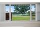 Framed view of a serene lake through a large window, bringing the beauty of nature indoors at 4421 28Th N Ave, St Petersburg, FL 33713