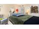 This bedroom features soft lighting, a well-dressed bed, and a vanity with elegant decor at 455 Alt 19 S # 65, Palm Harbor, FL 34683